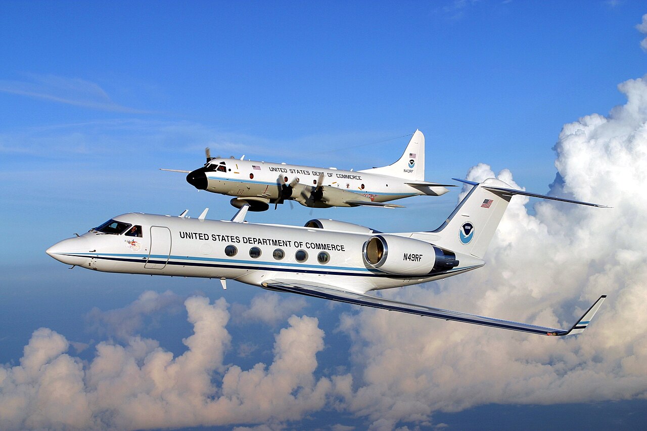 NOAA Gulfstream IV and WP-3 Hurricane Hunter aircraft flying above clouds